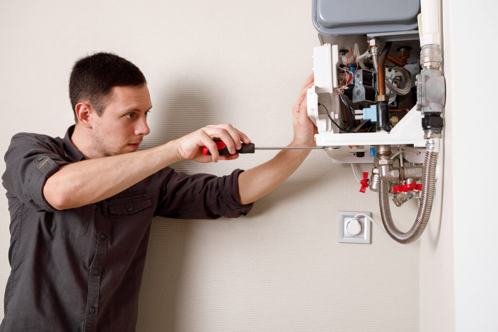 man repairing boiler medical mask