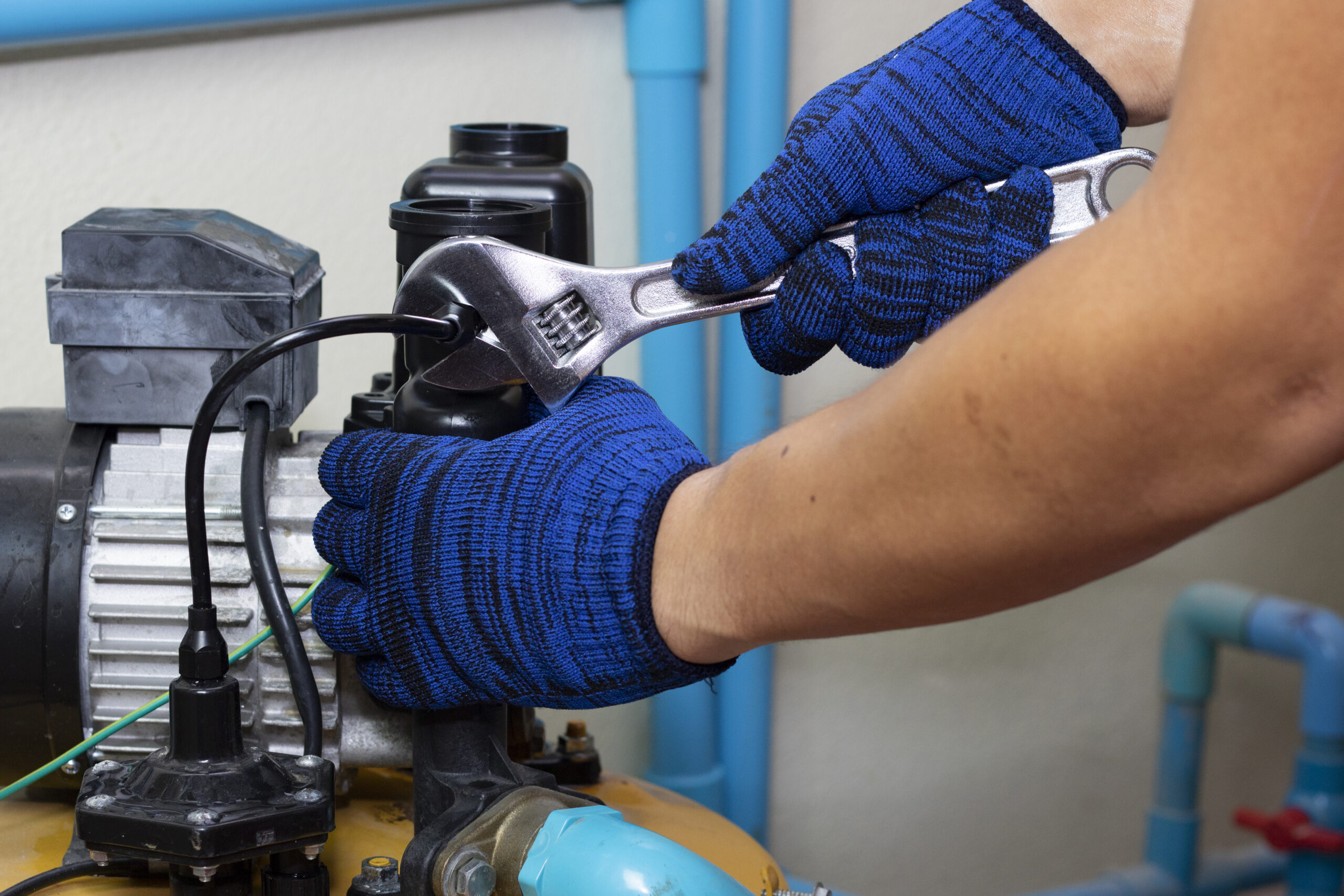 worker engineer maintenance repair gasget value water pump scaled